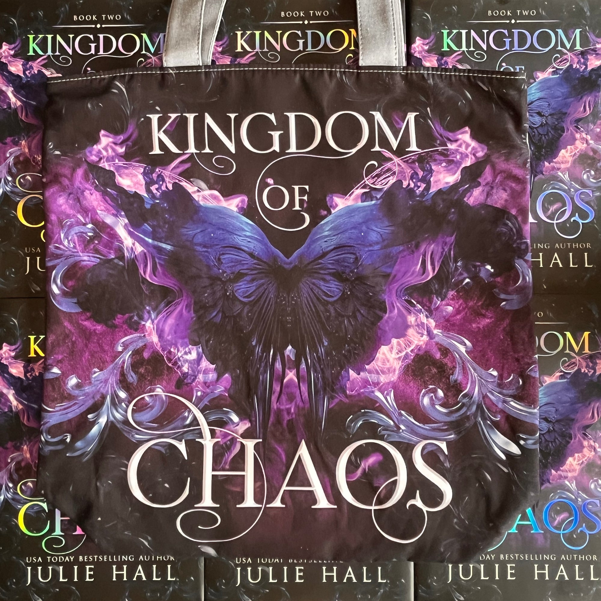 Luxury fabric tote bag, with image of the book cover of 'Kingdom of Chaos' by Julie Hall with a butterfly design on a dark background.