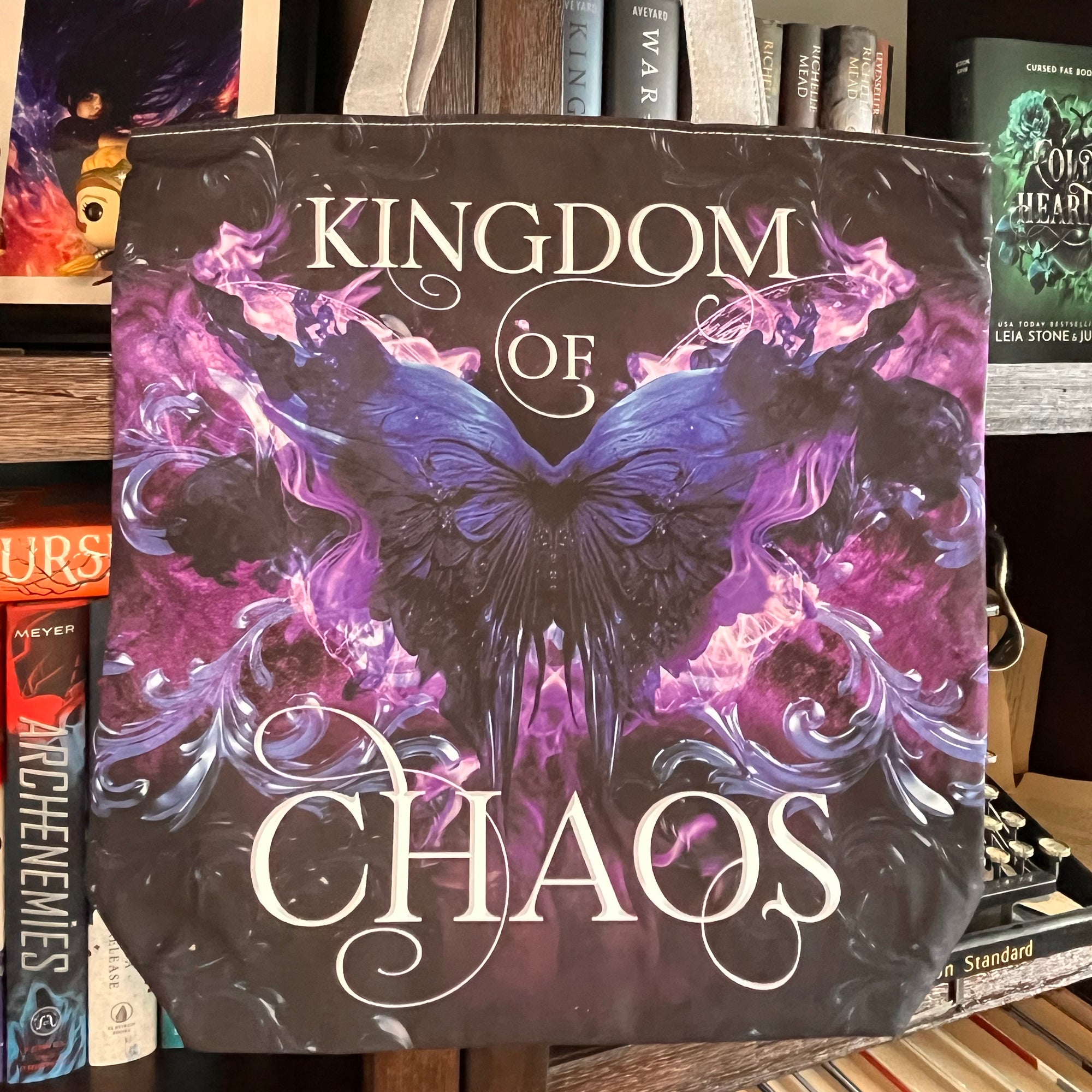 Luxury fabric tote bag with the book cover from 'Kingdom of Chaos' with a butterfly design.